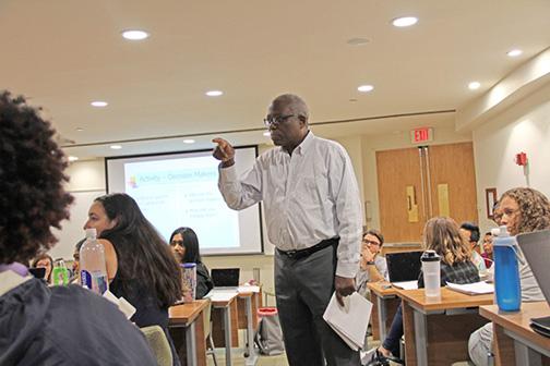 Harold Cox in the classroom, teaching students what it means to be an advocate in the local community. Photo by Michelle Samuels