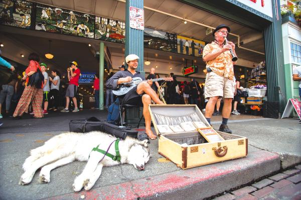 The Speakeasy Jazz Cats — Sam Deleo, left, and John Salzano — play in one of the premier spots at Pike Market. Photo by Matthew S. Browning