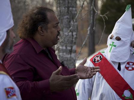 Anti-racist activist Daryl Davis talks with a Klan member at a rally in Missouri. Photo courtesy of Daryl Davis