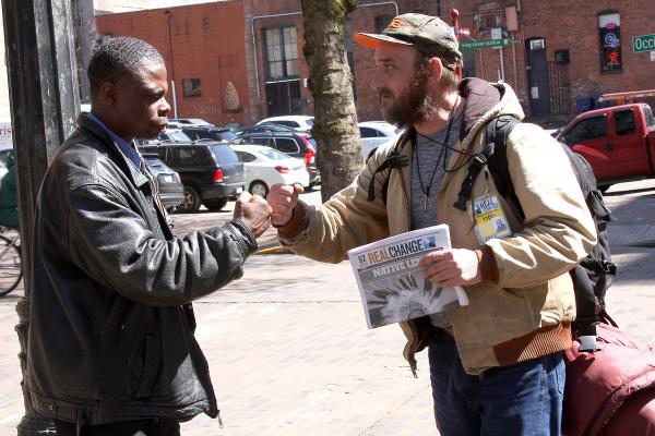 Donald Morehead works with another vendor in Occidental Square.
