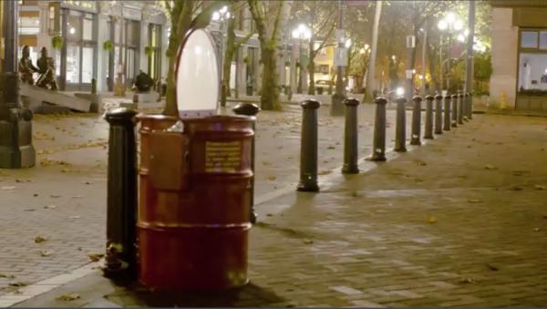 Britta Johnson’s fire barrel sculpture plays a 20-second video of flames for a quarter. It will be on display at 4Culture at 101 Prefontaine Pl. S. on Dec. 1 for the First Thursday Art Walk. Photo courtesy of Britta Johnson