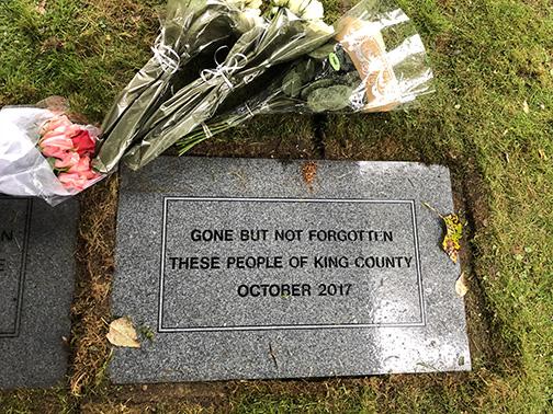 The King County Medical Examiner lays a stone to remember people whose remains went unclaimed. Photo courtesy King County Medical Examiner
