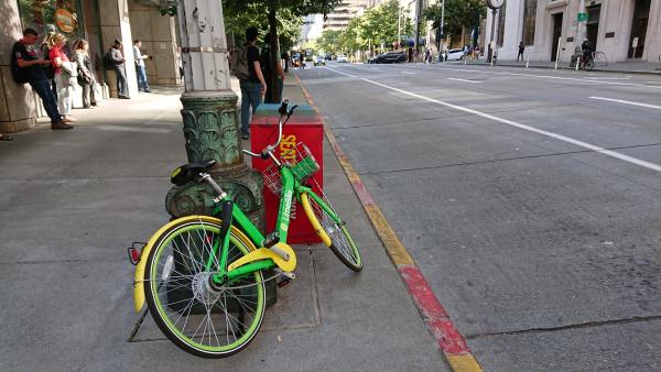 A bike from Lime parked near the intersection of Second Ave. and Cherry Street. Photo by Lisa Edge