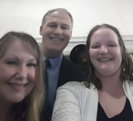 Lisa Sawyer right, with Gov. Jay Inslee and Mindy Woods at the Governor's Mansion.