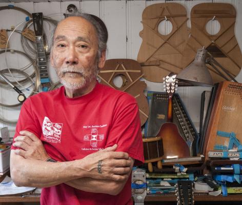 Seattle Black Panther Party member Mike Tagawa drove a bus for King County Metro from 1980 to 2016. Now retired from Metro, Tagawa repairs Martin Company guitars. Photo by Monica Westlake