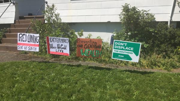 Signs posted on the front lawn of Reagan Jackson's Rainier Beach home. Photo by Reagan Jackson