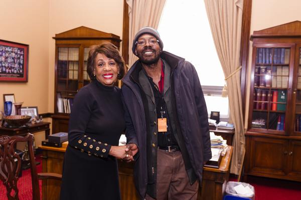 United States Representative Maxine Waters with Street Sense Media vendor Reginald Black. Photo by Rodney Choice