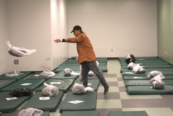 Seattle’s City Hall shelter run by the Salvation Army is a mat-on-the-floor model that leave people sleeping head-to-toe. Real Change file by Jon Williams, 2015