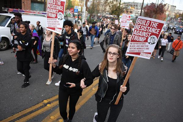 Natalie and Vanessa are 11th graders at Center marching in the Anti-Trump rally from Cal Anderson Park to Westlake. Photo by Jon Williams, Real Change