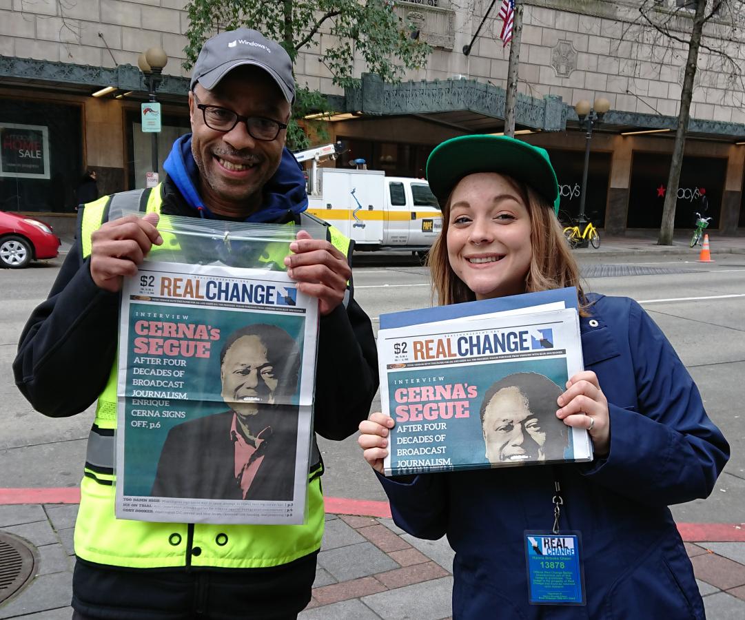 In 2018 writer and Real Change columnist Hanna Brooks Olsen sold the paper alongside vendor Glenn Walker. Photo by Lisa Edge