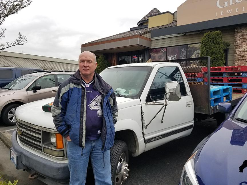 Holton Miller is one of thousands of people in Seattle that has had their vehicle towed. It was his only form of shelter. Photo by Ashley Archibald