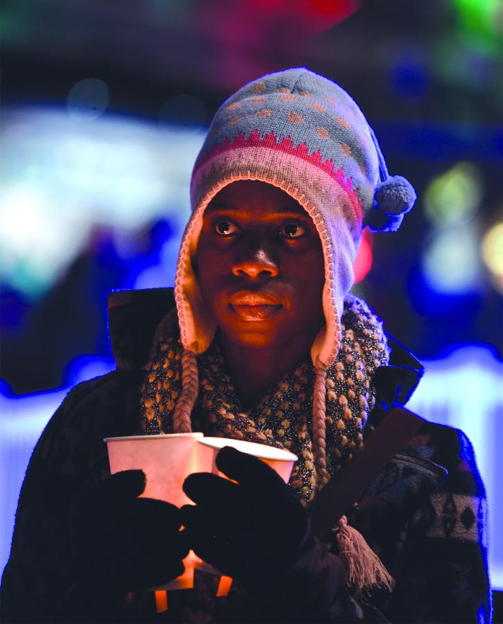 Micheline Lubin participated in the Women in Black Candlelight Vigil which began at sundown Dec. 21 at Victor Steinbrueck Park. They silently marched to Westlake Park. Photo by Valerie Franc-Houge