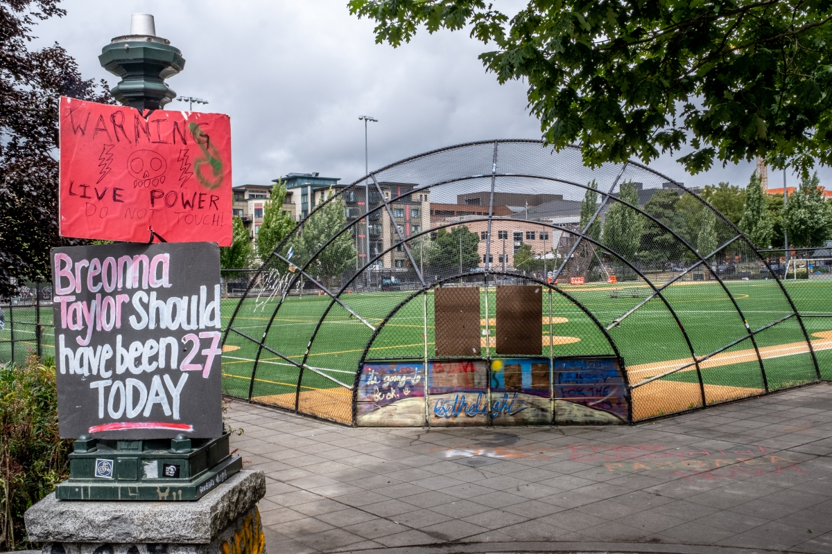 City of Seattle officials cleared the Capitol Hill Occupied Protest (CHOP) in the early morning hours of July 1 after weeks of an organic community claiming the area, rallying around three core demands: defund the Seattle Police Department, invest in comm