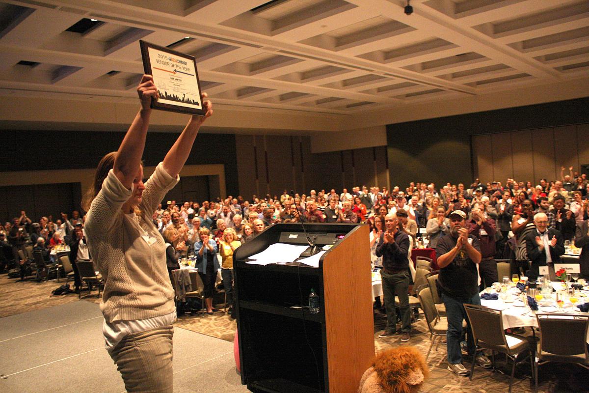  Lisa Sawyer holds her award to a standing ovation