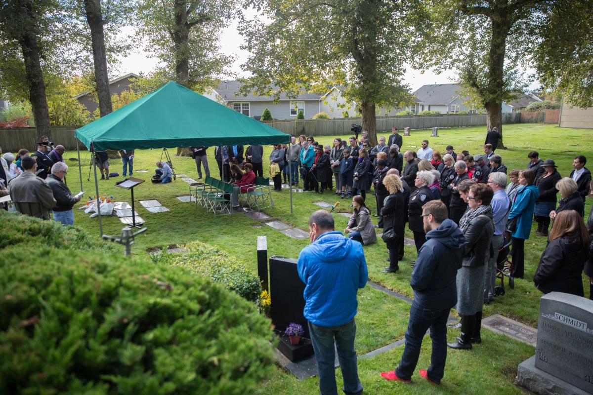 People gather at Mt. Olivet Cemetery on Oct. 5 to pay their respects to the 278 indigent men and women who have died in King County since 2014.