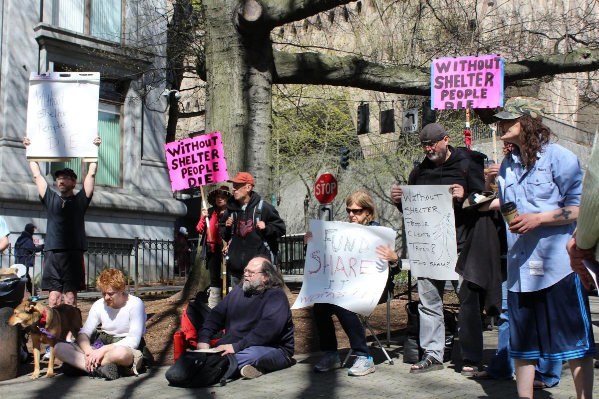 SHARE supporters rallied in front of the King County Courthouse on March 31 for funds to keep its Seattle shelters open.