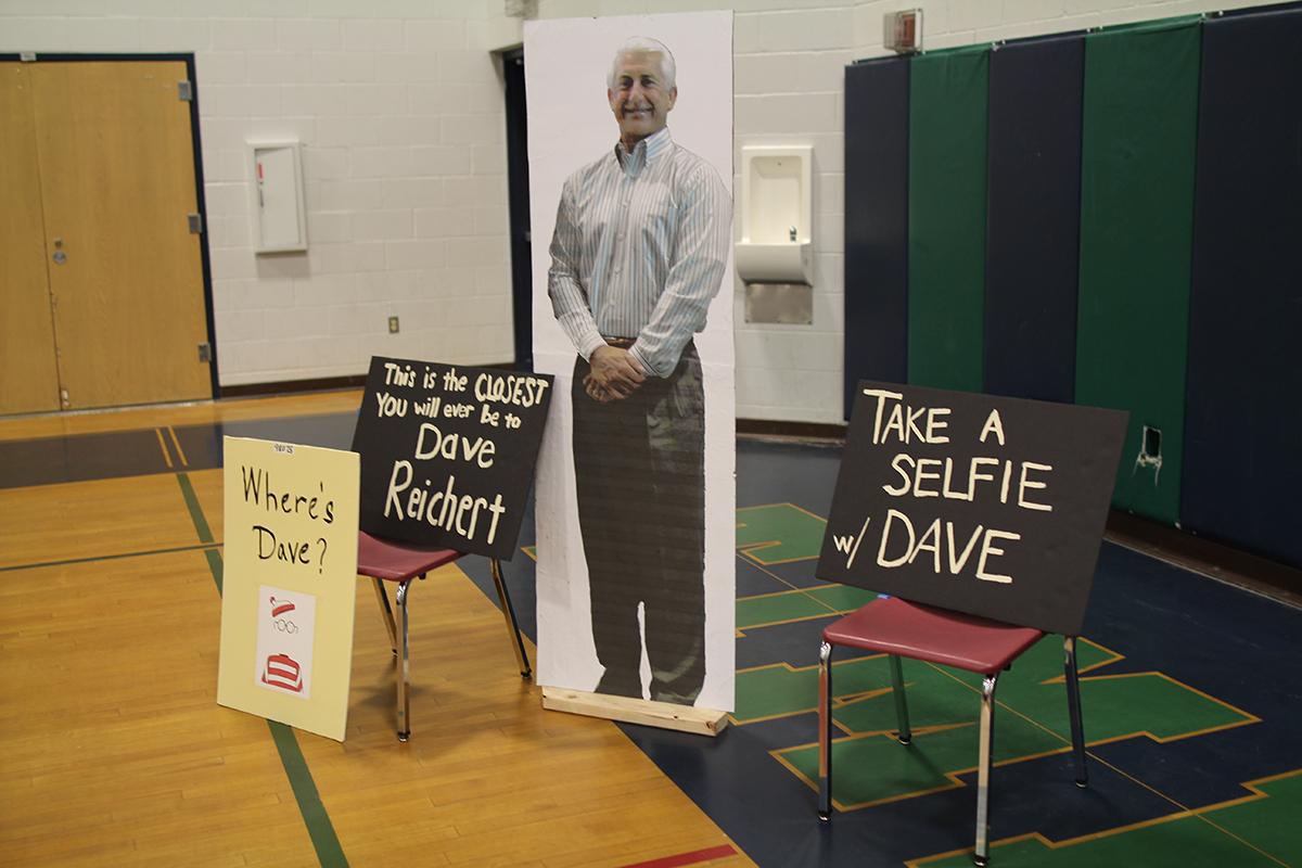 Covington activists hold an open seat for absent U.S. Rep. Dave Reichert in protest for his absence in recent town hall events in his district. Photo by Bernard Ellouk