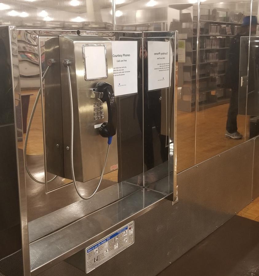 Anyone is free to use the free phones at the downtown branch of Seattle Public Library. Photo by Ashley Archibald