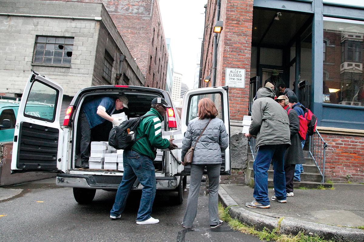 Every Wednesday, a van packing more than 10,000 copies of Real Change arrives at 96 S Main St. Photo by Rich Mealey