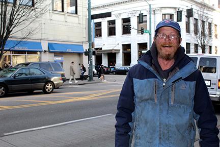 Michael Betcher, a man experiencing homelessness, has lived in the U District for the past two years and has expressed frustration over a lack of accessible housing. Photo by Amy Wong