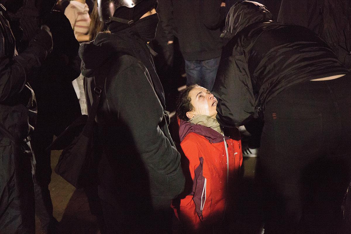 A pepper-sprayed protester in Red Square during the protest of Milo Yiannopoulos at UW. Photo by Lauren Kelly