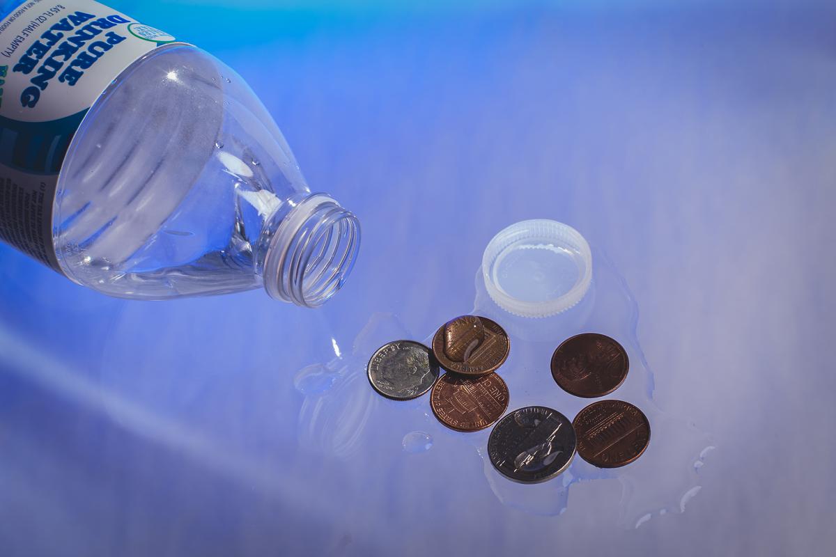 Like the soda tax, Washington’s bottled water tax, which began in August, may unfairly impact low-income people. Photo illustration by Matthew S. Browning