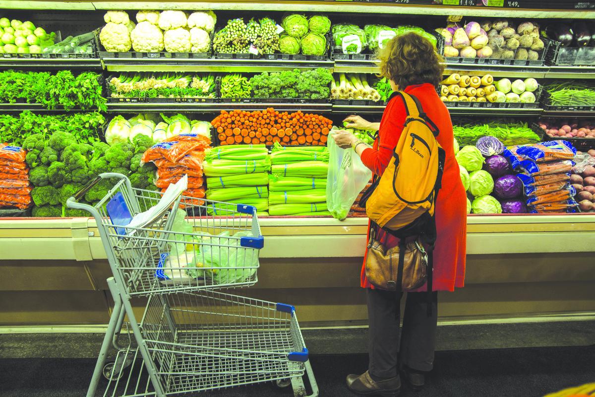 Real Change contributor Susan Storer Clark shops for ingredients at the Kress IGA on Third Avenue downtown.