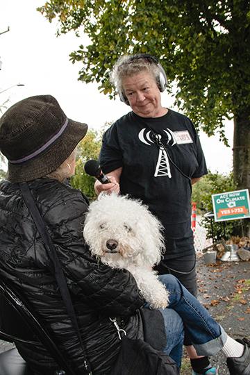 Pamela Burton interviews Cecile Andrews at a pop-up park in Greenwood. Burton is trying to get her low-power FM radio station on the air, but must first clear financial and technical hurdles. Photo by Matthew S. Browning