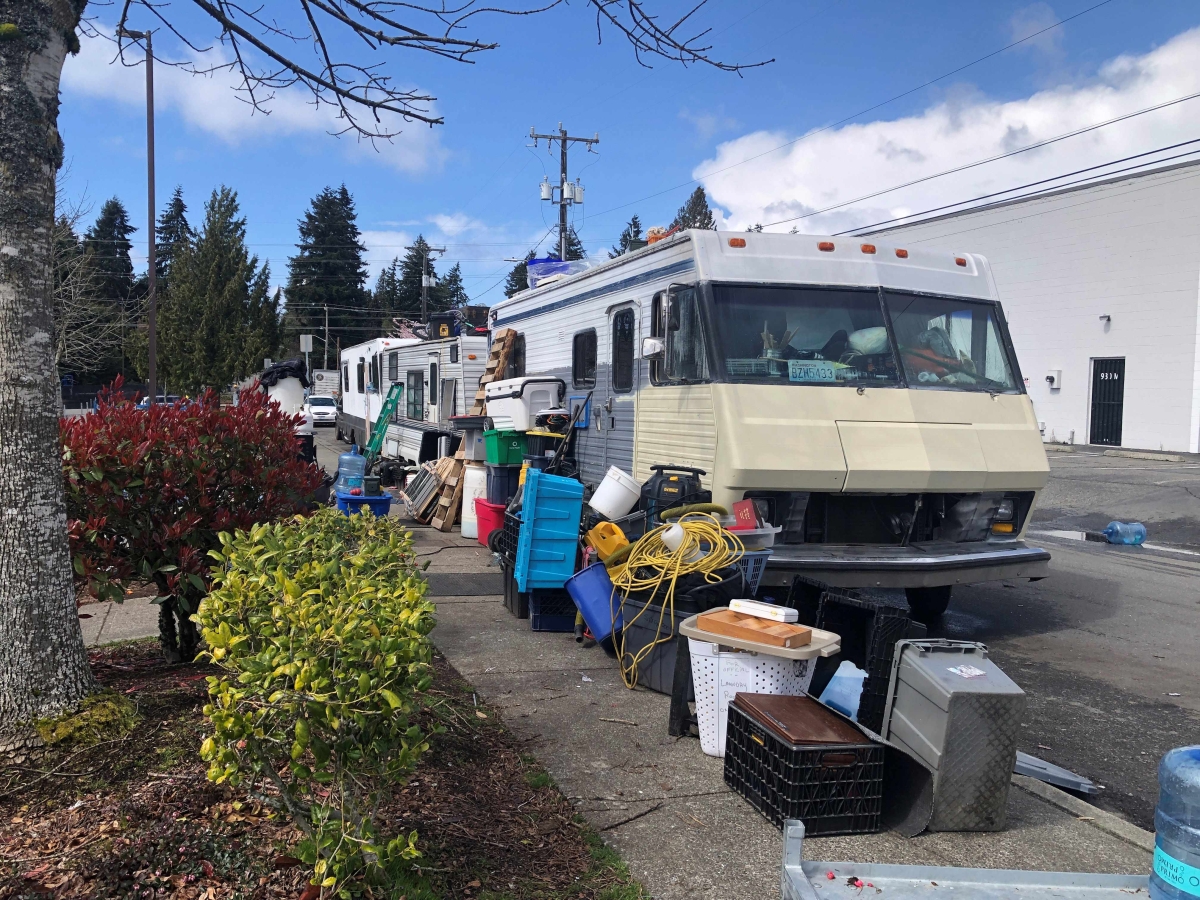 A row of RVs parked on a side street in north Seattle.