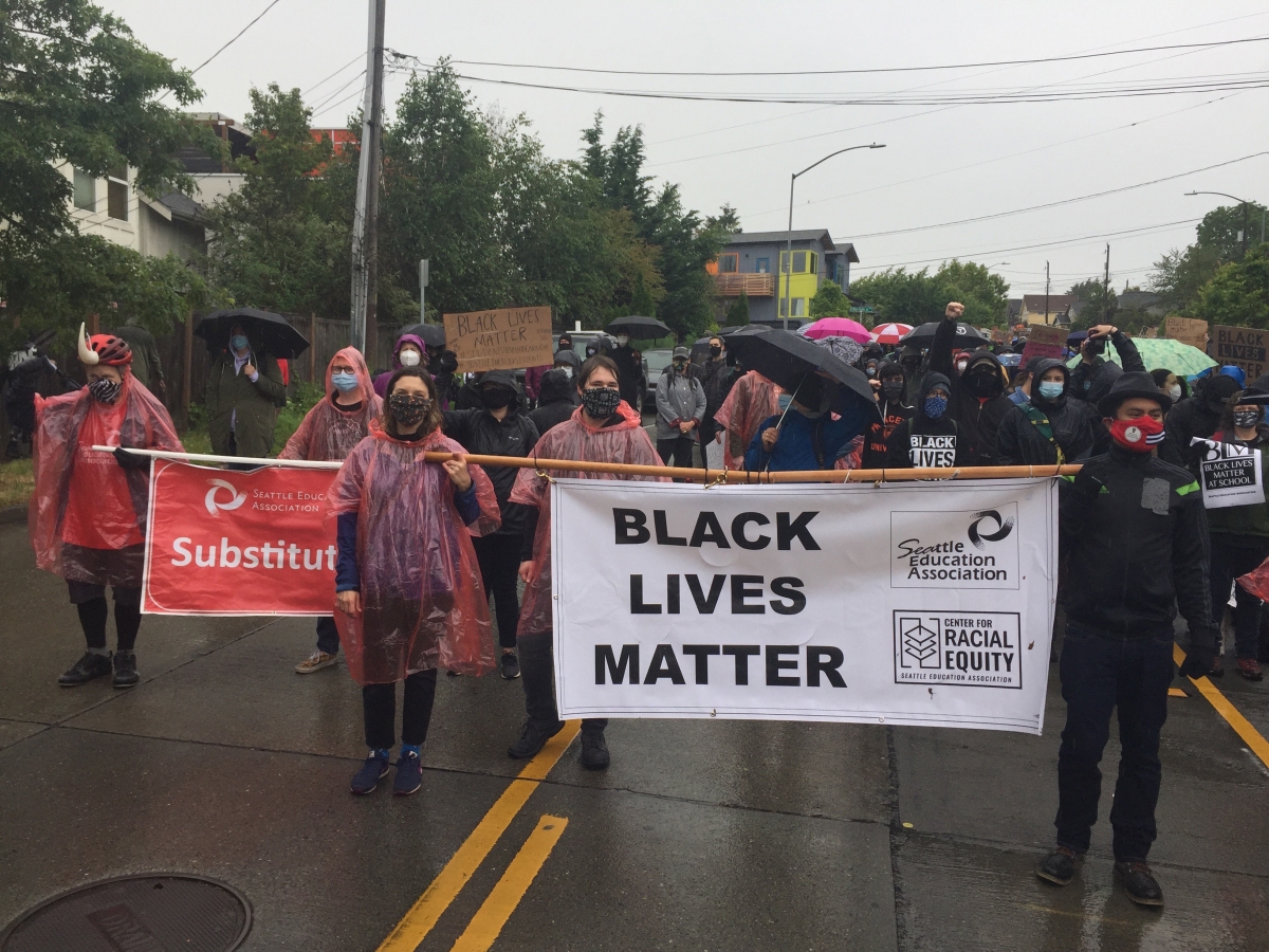 Members of the Seattle Education Association participate in a recent march in Seattle, carrying signs supporting Black Lives Matter. Photo by Darrin Hoop