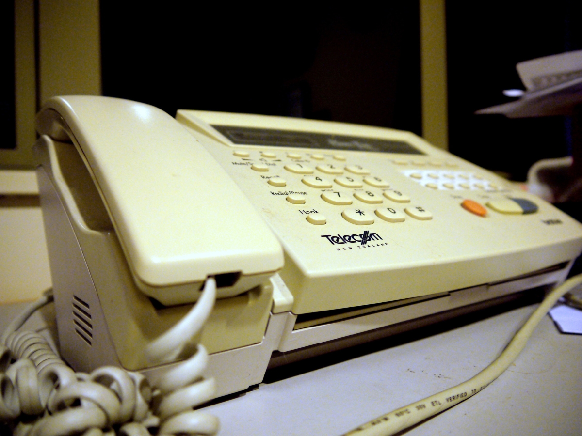Photograph of old-school phone/fax console with keypad