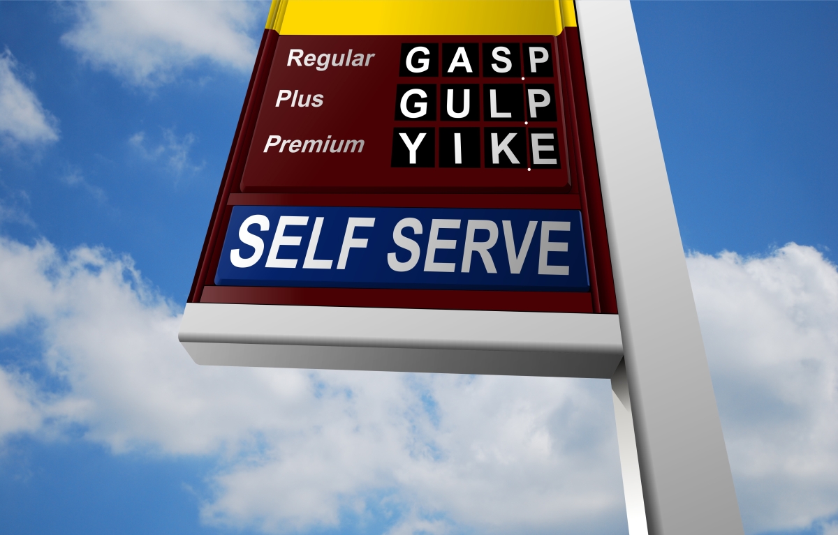 Photograph of gas-station sign reading, "Gasp, Gulp, Yike" where prices would be displayed