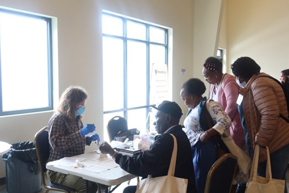 Community members get tested for hepatitis at a recent Hepatitis Education Project (HEP) testing event.