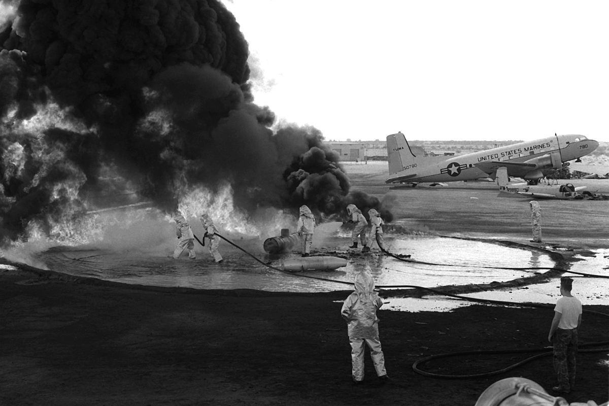 Marine reservists train in fire-fighting at Marine Corps Air Station in Yuma, Arizona, in asbestos suits, January 1983.