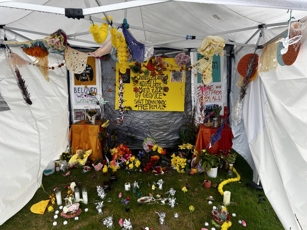 A vigil for Charlies Leo Daniels and other detainees who have lost their lives stands in front of the Northwest Detention Center. The memorial was created by La Resistencia, a grassroots immigrant advocacy organization, for individuals to pay their respec