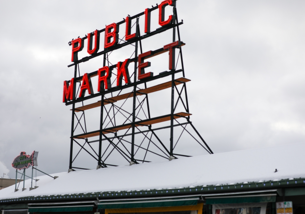 Roof of Seattle's Public Market shows sign surrounded by several inches of snow