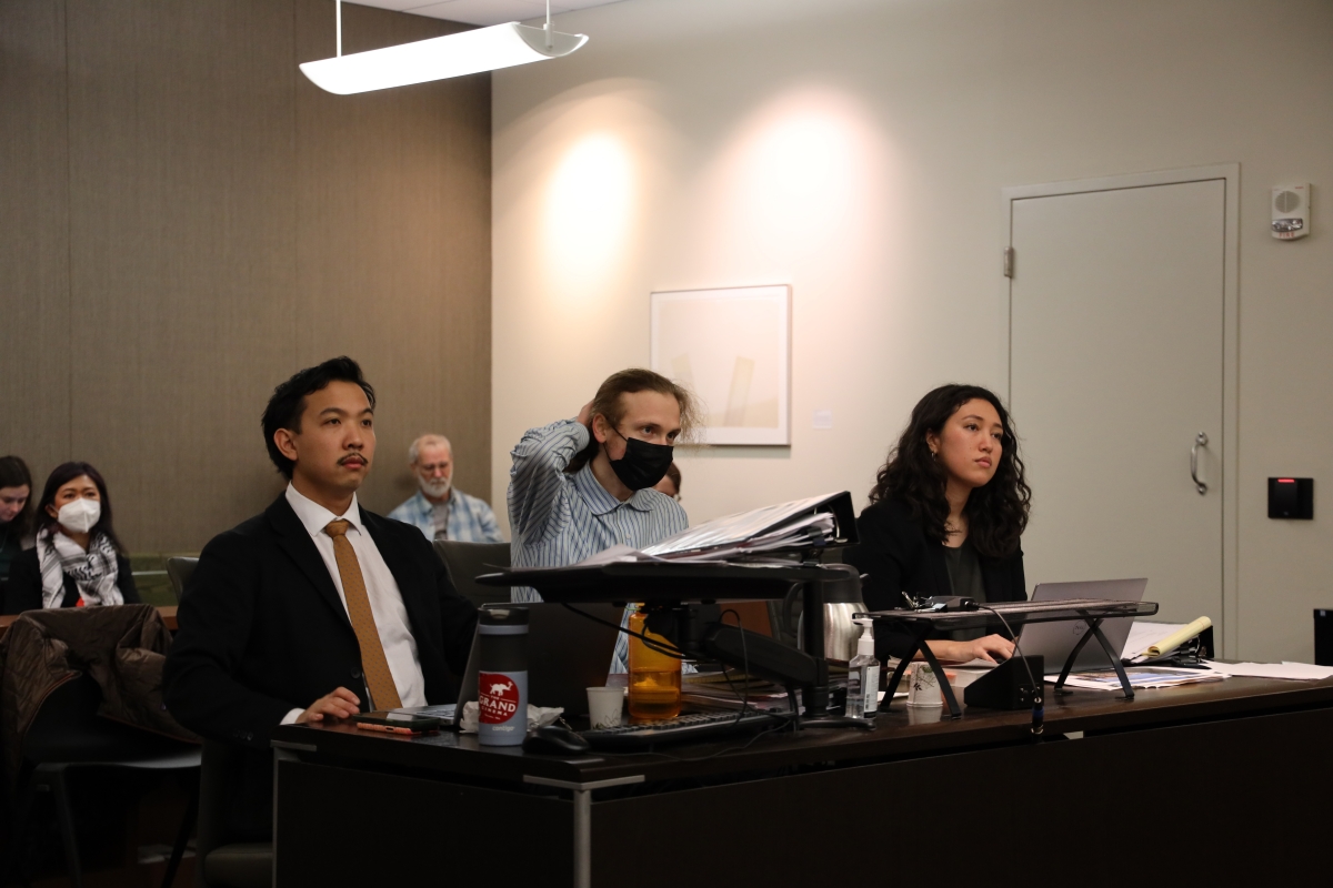 From left, Sam Sueoka, Aidan Carroll and Jaclyn Tani listen to the judge at the counsel table, Jan. 24.