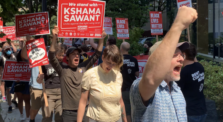Supporters of City Councilmember Kshama Sawant made their voices heard Aug. 2 outside the offices of the recall’s lawyer. Photos by Hannah Krieg