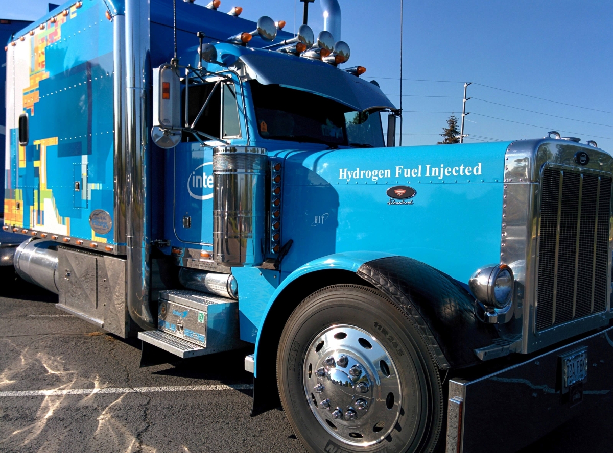 Photograph of large truck with words, "Hydrogen Fuel Injected" on its hood