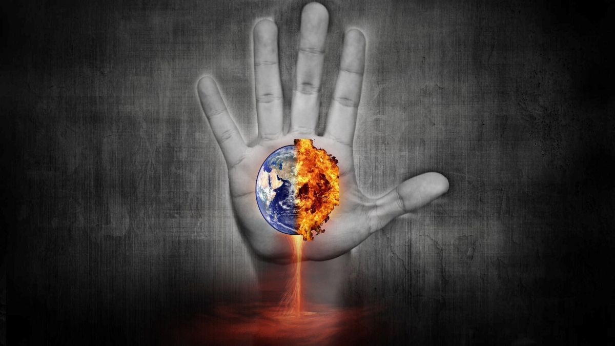 Drawing of black and white hand with image of Earth's globe in color, burning at the edges