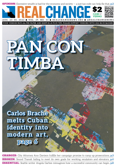 Bird's-eye view photograph of room in gallery with various color-gridded shapes pasted to floor and wall. Headline reads, "Pan Con Timba."