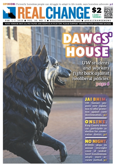 Photograph of Husky dog statue under headline, "Dawgs' House"