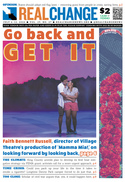 The two lead actors from Village Theatre's "Mamma Mia!" directed by Faith Bennett Russell embrace on stage, in front of a purple background with silhouetted mountains, wearing shorts and light summer button downs.