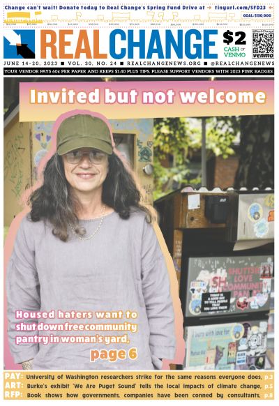 Smiling white woman, of young to middle age, wearing green cap and glasses, with shoulder-length dark hair, stands in photographic cutout in front of door marked with graffiti, under headline, "Invited but not welcome."
