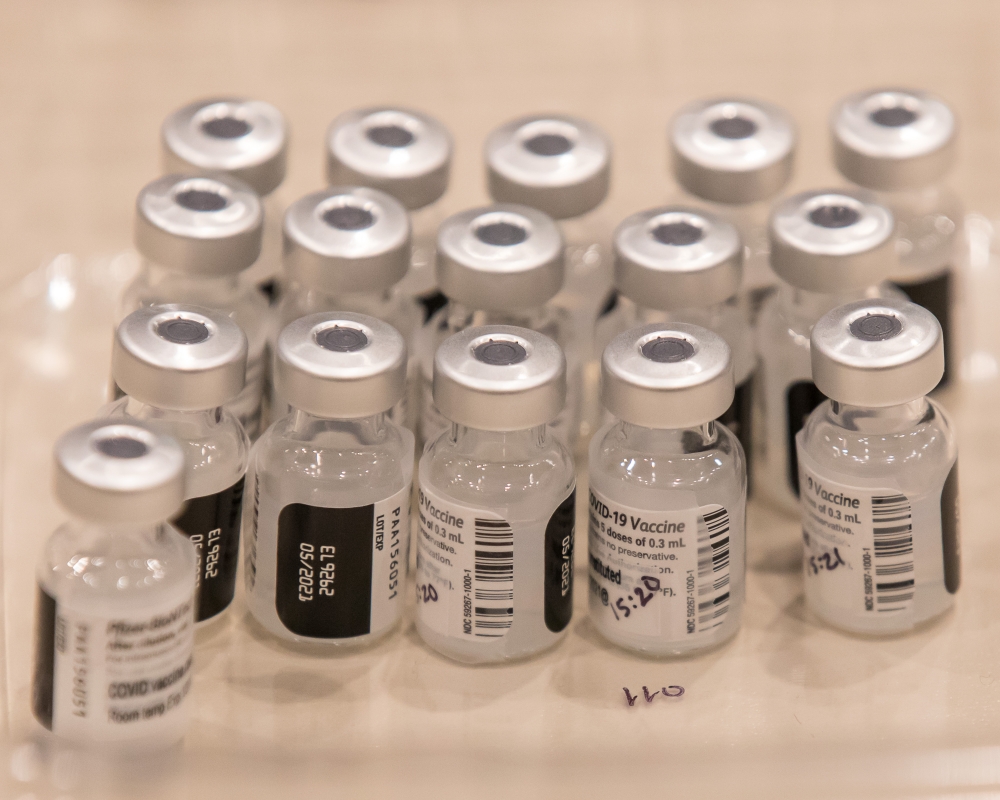 At the Amazon Meeting Center, vials of the Pfizer COVID-19 vaccine await drawing into syringes by Virginia Mason pharmacy technicians.