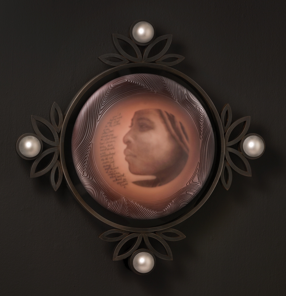 “Pearls, Himba Portrait series,” original text and images, screen-printed enamels, kiln-fired, blown, sand-carved, sandblasted and mirror glass, steel. Photo by Russell Johnson