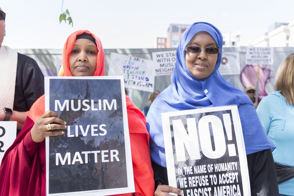 Ubah Haaji, left, and Ayan Abulahi speak out at counter protest Saturday in Seattle. Photo by Monica Westlake