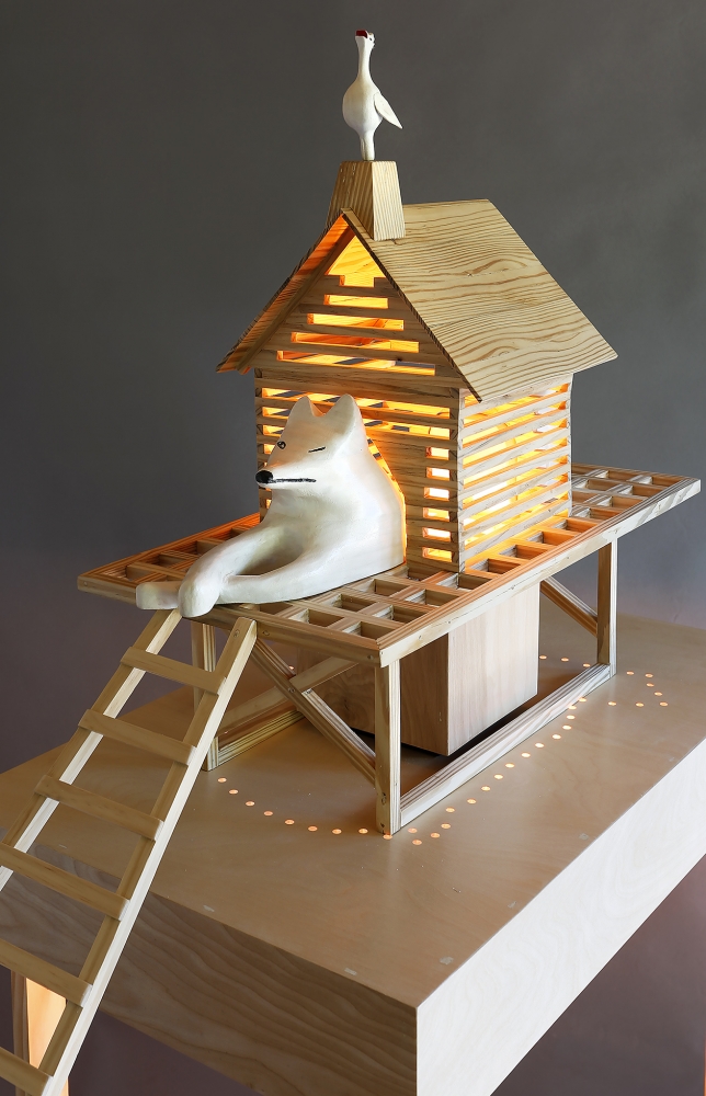 “Fox in a Henhouse (nod, nod, wink, wink, know what I mean?)” by Tom Gormally, wood, stain, acrylic paint, LED lights, plexiglass rod. Photo of artwork by Mark Woods
