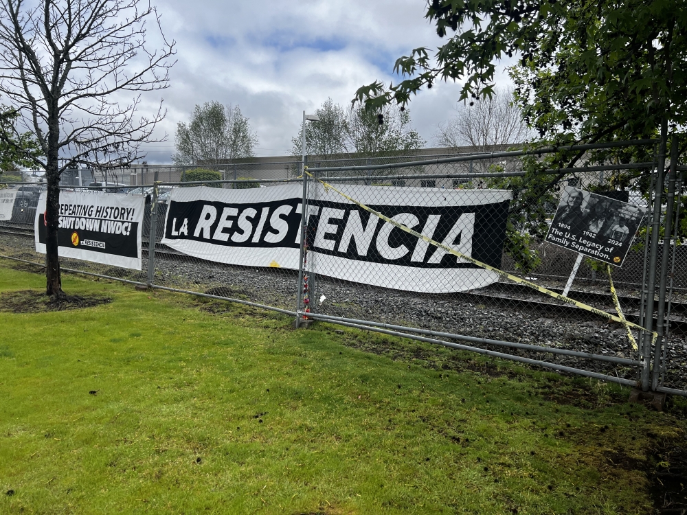 La Resistencia holds regular protests outside of the Detention Center and keeps banners on display at all times. 