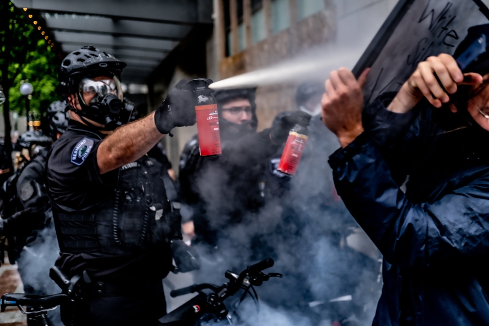 Seattle Police Department officers deploy an aerosol agent on Black Lives Matter protesters near Westlake Center, May 30, 2020.